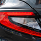 Close up of the 2022 WRX tail lights, showing an internal web of lines akin to magma or broken glass.